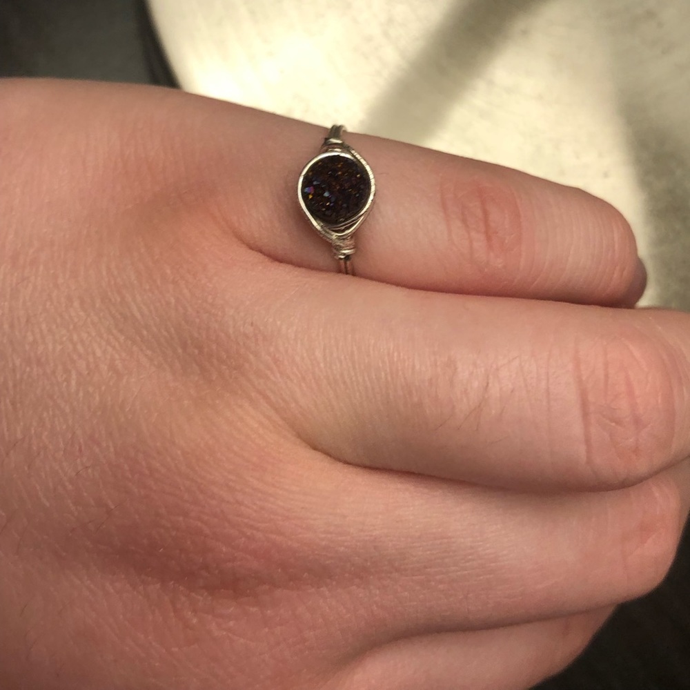 Silver wire ring with purpley red center